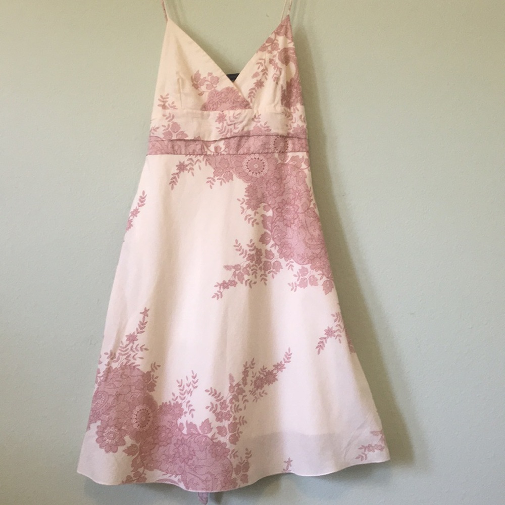 Adorable sun dress with pink floral design